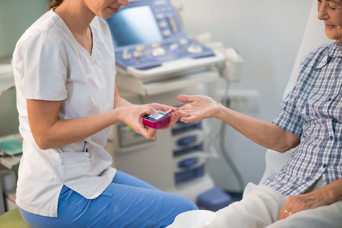 Nurse finger prick in hospital